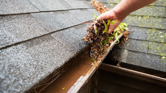 Hand Cleaning Copper Rain Gutter